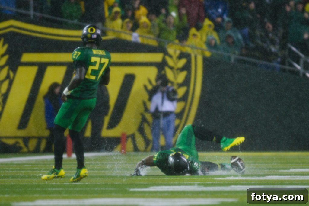 Καλή ποδοσφαιρική σεζόν 4 Φίλαθλοι των Oregon Ducks κάτω από έντονη βροχή